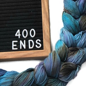 Hand-dyed, pre-wound weaving warp chain, 8/2 ring spun cotton, 3 3/4 yards, multiple ends, in shades turquoise, lavender, and brown DW265 400 ends