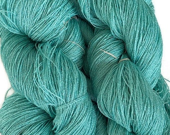 Hand-dyed 8/2 cotton and rayon yarn, 182 and 875 yard skeins, in tonal shades of blue-green