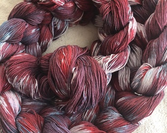 Hand-dyed, pre-wound, weaving warp chain, 10/3 cotton, 140 ends, 5 5/8 yards long, in shades of red, purple, blue, and natural - DW224