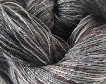 Hand-dyed rayon yarn, 6 strand/ply floss, 500 yard skeins, shiny, in shades of grey, sliver, and small amounts of brown