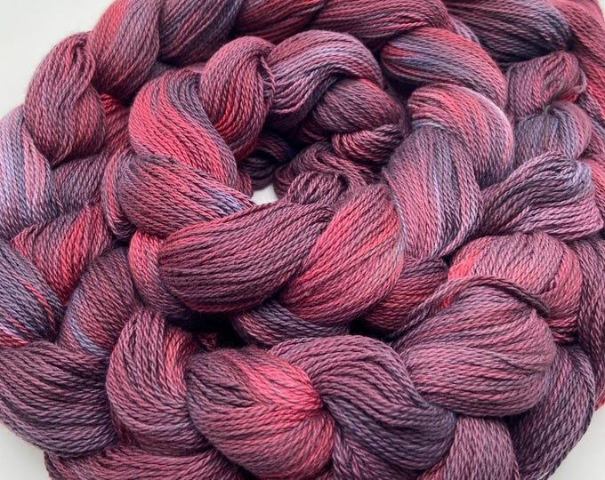 Hand-dyed pre-wound weaving warp, 8/2 ring spun cotton, 5 5/8 yards, in shades of burgundy, crimson, rust, navy, grey, and blue-grey -DW323