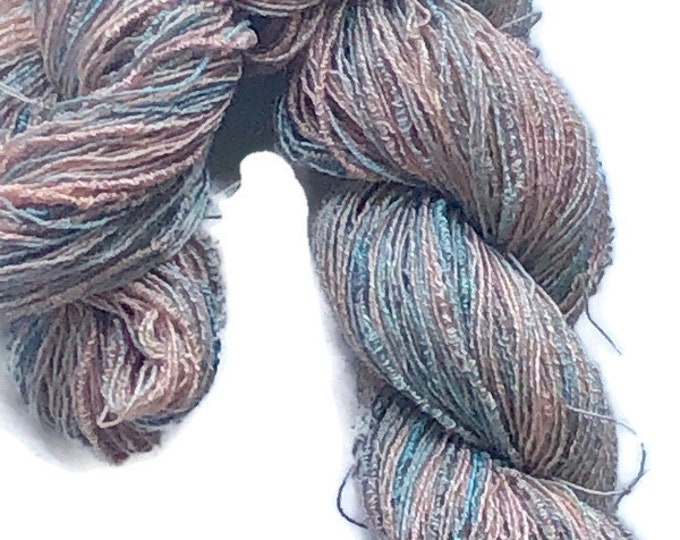 Hand-dyed cotton/rayon boucle yarn, 400 yard skeins, in shades of peach, apricot, blue-green, and sage green -DW133