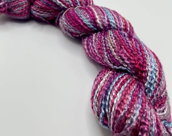 Hand-dyed rayon krinkle roving, 218 yard skeins, in shades of red purple, purple, blue, light blue, lavender, and pink - DY200