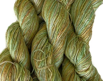 Hand-dyed rayon floss yarn, 350 yard skeins, in shades of green, pale green, beige, golden yellow, and straw