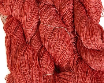 Hand-dyed 8/2 cotton and rayon yarn, 438 yard skein and 700 yard skeins, in tonal shades medium burnt orange