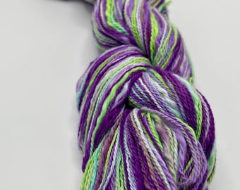 Hand-dyed cotton flake yarn, thick-n-thin, 350 yard skeins, in shades of bright green, light green, dark purple, purple, and lavender-DY212