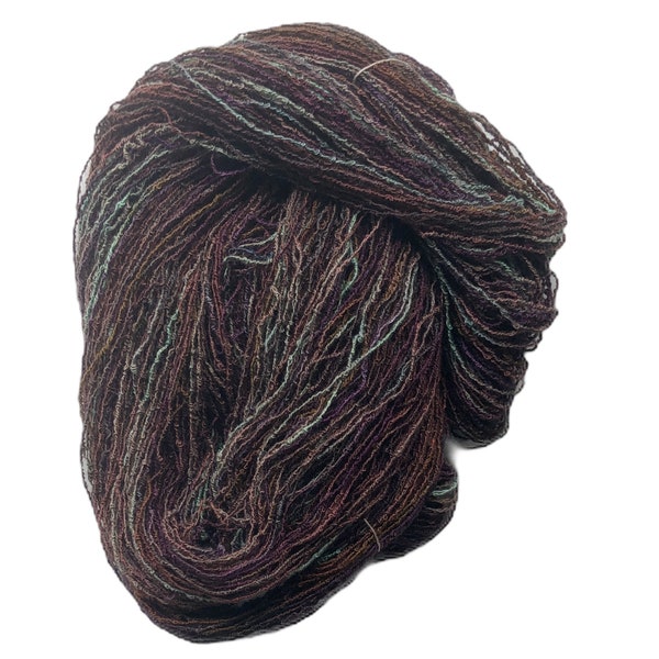 Hand-dyed cotton/rayon boucle yarn, 400 yard skeins, in shades of brown, green, sage green, purple, and red brown