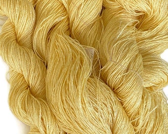 Hand-dyed 8/2 cotton and rayon yarn, 270 yard skein and 700 yards skeins, in tonal shades of pale to light yellow