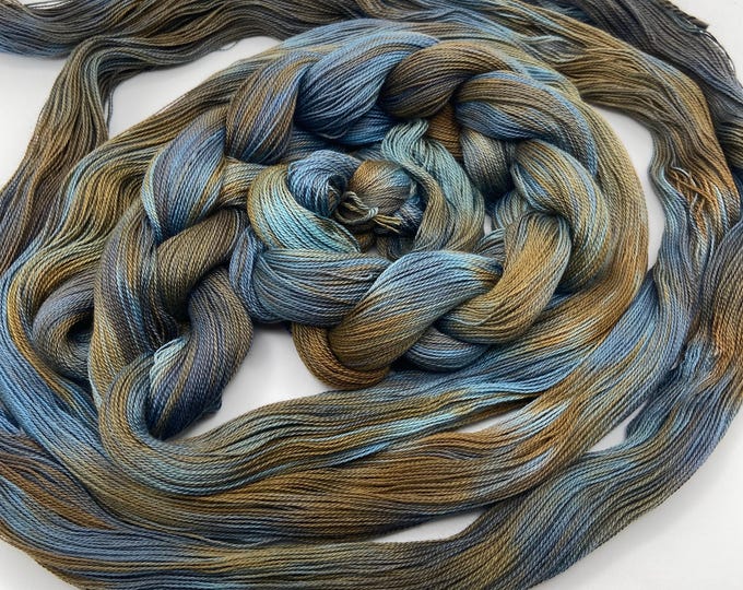 Hand-dyed pre-wound weaving warps, 16/2 supima cotton, 4 7/8 yards, in shades of blues, browns, dark golden browns, and greys - DW310