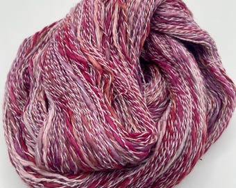 Hand-dyed cotton slub with synthetic, 350 yard skeins, in shades of burgundy, salmon, pink, dusty rose, maroon, and white - DY207