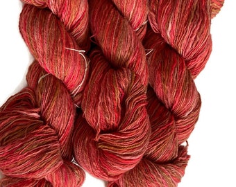 Hand-dyed cotton thick and thin yarn, 525 yard skeins, in shades of red, pink, beige, and brown -DY168