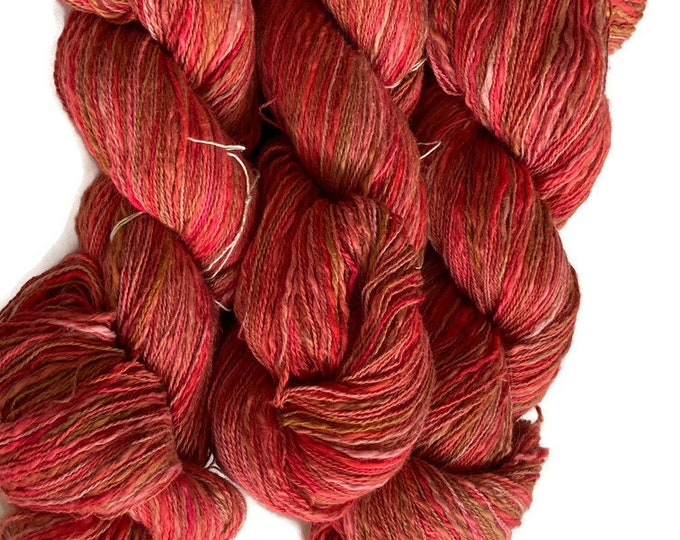Hand-dyed cotton thick and thin yarn, 525 yard skeins, in shades of red, pink, beige, and brown -DY168