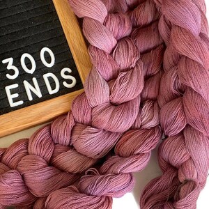 Hand-dyed, pre-wound weaving warp, 14/2 cotton, 6 7/8 yards, multiple ends, in tonal shades of old rose, blush, and pink lavender DW274 300 ends