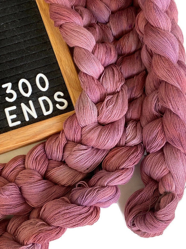 Hand-dyed, pre-wound weaving warp, 14/2 cotton, 6 7/8 yards, multiple ends, in tonal shades of old rose, blush, and pink lavender DW274 300 ends