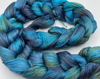 Hand-dyed pre-wound weaving warp, 8/2 tencel/lyocell, 4 7/8 yards, in shades of turquoise, purple, grey purple, bronze, olive green - DW325