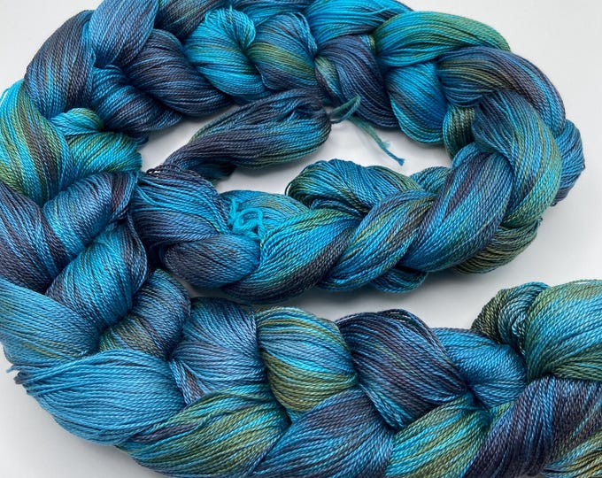 Hand-dyed pre-wound weaving warp, 8/2 tencel/lyocell, 4 7/8 yards, in shades of turquoise, purple, grey purple, bronze, olive green - DW325