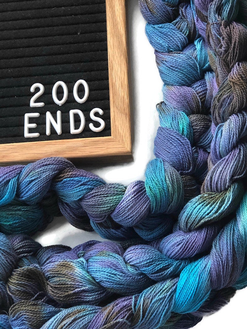 Hand-dyed, pre-wound weaving warp chain, 8/2 ring spun cotton, 3 3/4 yards, multiple ends, in shades turquoise, lavender, and brown DW265 200 ends