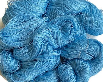 Hand-dyed 8/2  cotton and rayon yarn, 315 and 700 yard skeins, in tonal shades of light sky blue