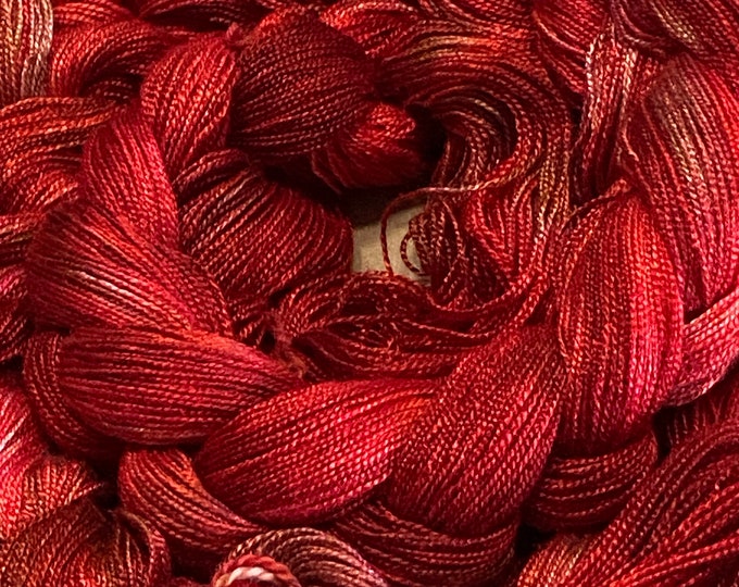 Hand-dyed, pre-wound weaving warp, 8/2 rayon, 4 3/4 yards, multiple ends, in tonal shades of red, brick, crimson, copper, and maroon- DW300