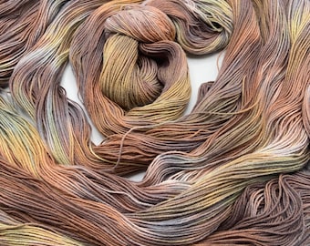Hand-dyed pre-wound weaving warp, 10/3 cotton, 4 3/4 yards, in shades of grey, brown, straw, peach, khaki, taupe, and natural - DW302