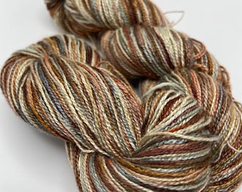 Hand-dyed 8/2 rayon yarn, 393 yard skeins, in shades of brown, grey, cream, peach, sage, and burnt orange -DY197