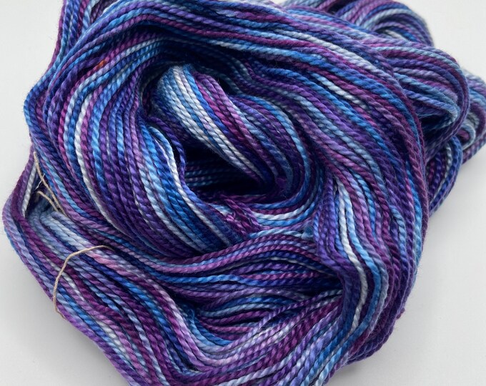 Hand-dyed mercerized 3/2 cotton, 175 yard skeins, in shades of blue, purple, light blue, lavender, red purple, pale blue, and white-DY193