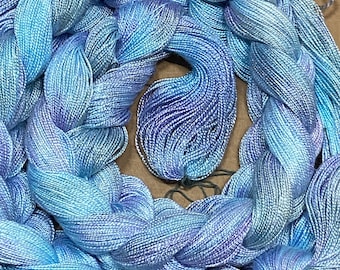 Hand-dyed pre-wound weaving warp, 8/2 rayon, 4 7/8 yards, multiple ends, in shades of sky blue, light blue, lavender, and light grey - DW295