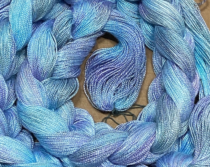 Hand-dyed pre-wound weaving warp, 8/2 rayon, 4 7/8 yards, multiple ends, in shades of sky blue, light blue, lavender, and light grey - DW295