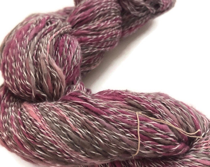Hand-dyed, cotton and synthetic yarn, thick and thin, 400 yards, in shades of pink, red purple, brown, beige, and white
