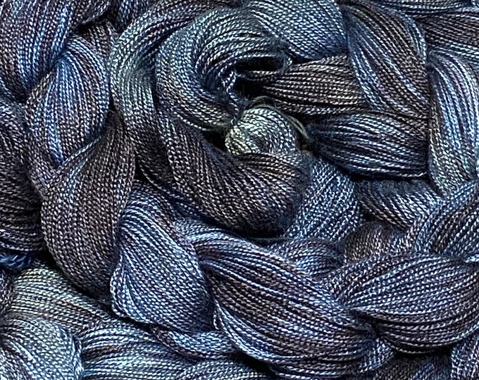 Hand-dyed, pre-wound weaving warps, 8/2 rayon, 5 7/8 yards, multiple ends, in shades of black, charcoal. steel blue, light blue, grey- DW293