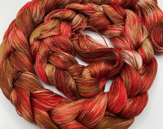 Hand-dyed pre-wound weaving warp, 8/2 tencel/lyocell, 4 7/8 yards, in shades of red, brown, taupe, salmon, and white - DW328