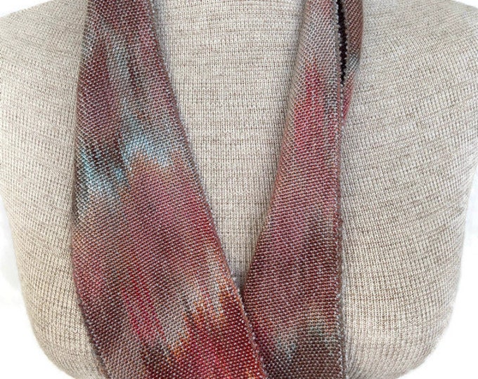 Hand-dyed, handwoven skinny infinity scarf, 3” x 37”, Tencel, in shades of taupe, brown, beige, brick red, peach, orange, and light silver