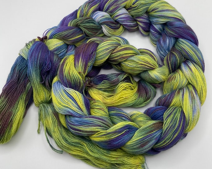 Hand-dyed pre-wound weaving warp, 14/2 cotton, 4 7/8 yards, in shades of blue, purple, yellow, green, brown, light blue, and natural -DW308