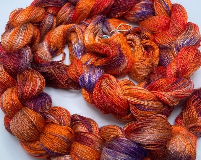 Hand-dyed pre-wound weaving warp, 12/2 rayon, 5 yards, in shades of orange, purple, rust, peach, lavender, red orange, and white - DW307