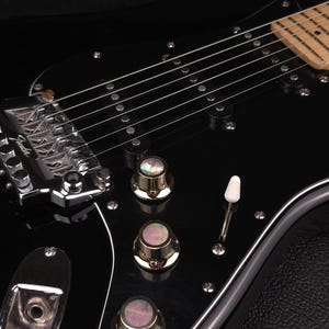 Custom guitar knob set. Brass with Black Mother of Pearl inlay.