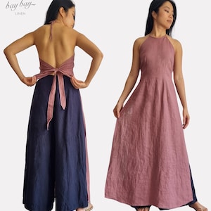 May include: A dusty rose linen halter top with a tie-back closure paired with navy blue wide-leg trousers. The garment features a textured fabric finish and a long, flowing silhouette. The text "bay bay LINEN" is visible in the top left corner.