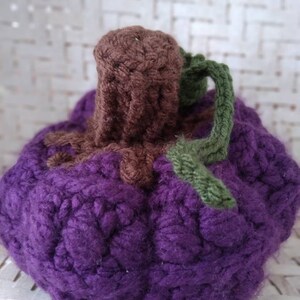 Large purple crocheted stuffed fall decoration pumpkin