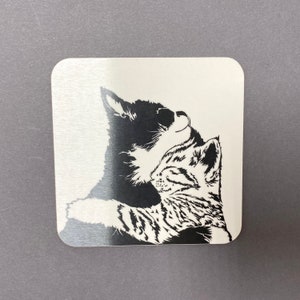 We also offer a coaster with our cuddling kittens on it.