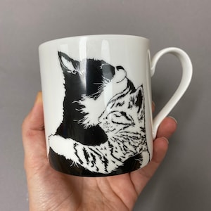 We also have a mug with the much loved cuddling kittens on it.