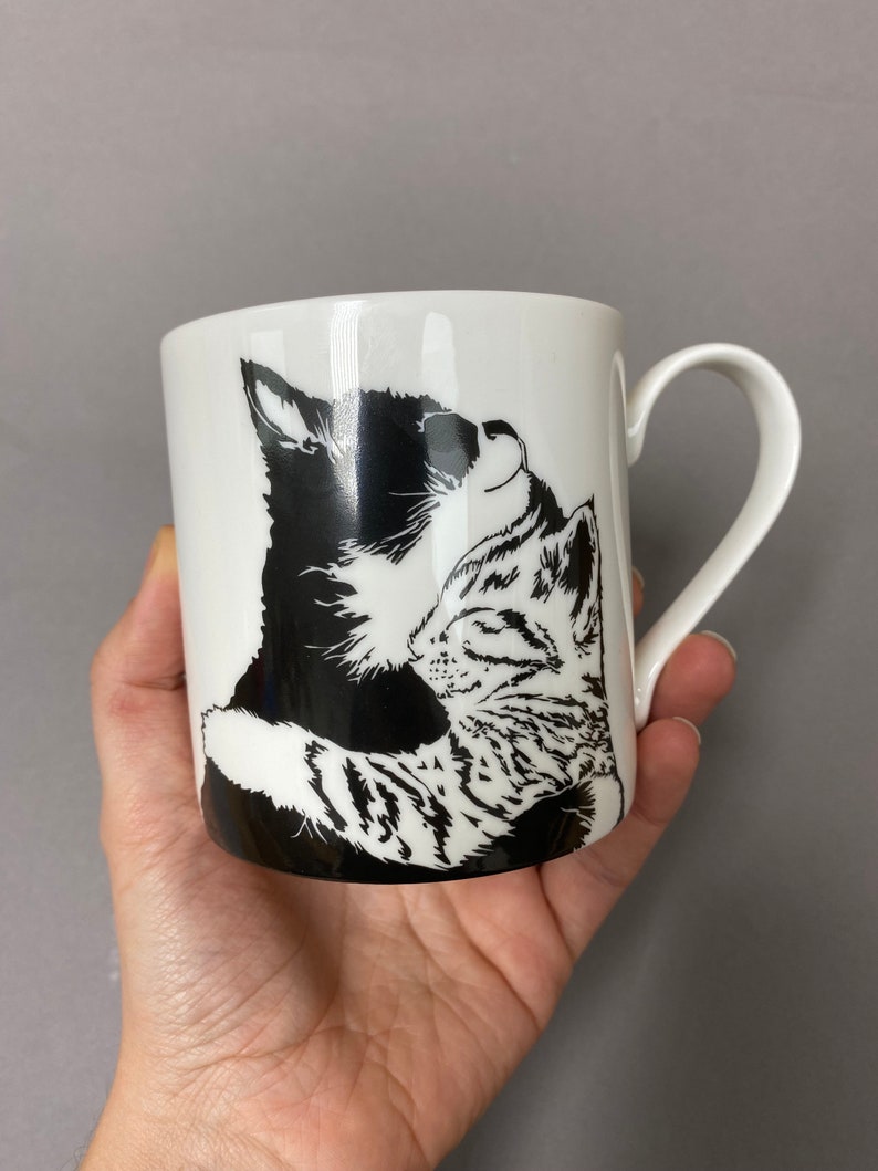 We also have a mug with the much loved cuddling kittens on it.