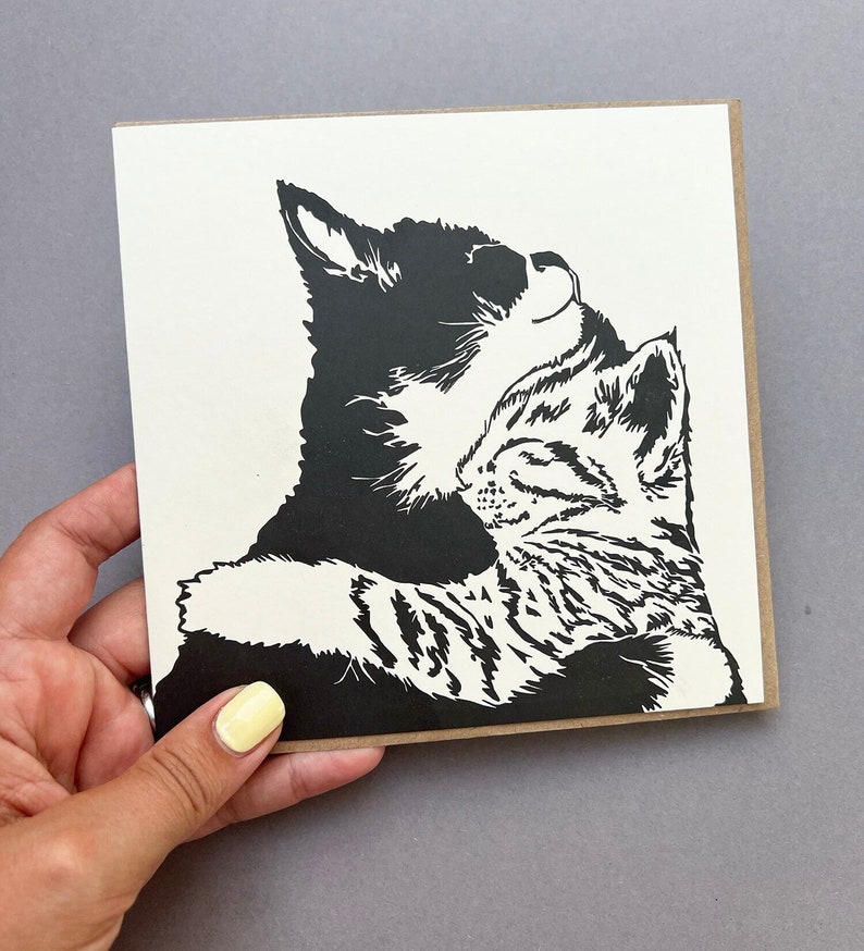 Beautiful Letterpress printed card of two kittens cuddling. One Tabby and one black and white kitten having a snuggle.