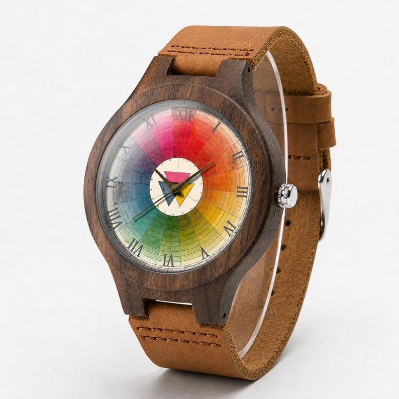 May include: A wristwatch with a dark brown wooden case and a tan leather strap. The watch face features a circular rainbow color wheel design with black Roman numerals and a central white circle containing a pink and yellow triangle icon.