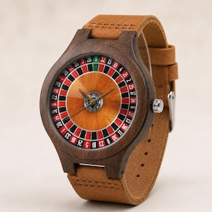 May include: Wooden wristwatch with a roulette wheel face. The watch has a dark brown wooden case, a brown leather strap, and a silver buckle. The watch face displays a roulette wheel design with red, black, and green segments.