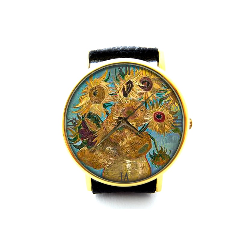 May include: A gold-tone wristwatch with a black leather band. The watch face features a painting of sunflowers in a vase, with Roman numeral hour markers.