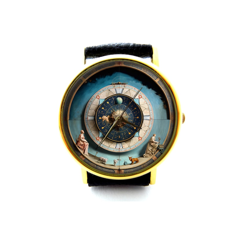 May include: A gold-tone wristwatch with a black leather band. The watch face features a detailed illustration of a celestial clock with zodiac symbols and planets.