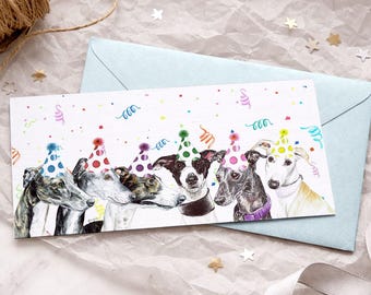 May include: A rectangular greeting card featuring a watercolor illustration of six greyhounds wearing colorful polka-dot party hats, surrounded by confetti and streamers against a white background, resting on a light blue envelope.