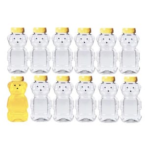 May include: Ten clear plastic bear-shaped honey bottles with yellow lids. One bottle is filled with honey.