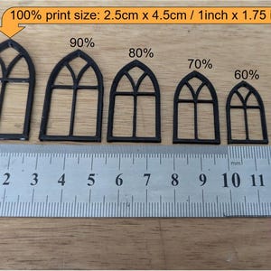 May include: Black miniature arched window frames in varying sizes, ranging from 50% to 100% print size. The largest frame measures 1 inch x 1.75 inches. A ruler is placed below the frames for scale.