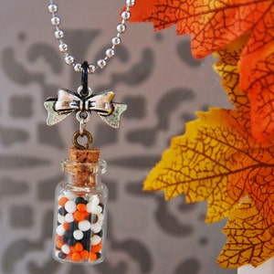 Ball chain necklace, glass vial containing Halloween candy, phosphorescent necklace, glows in the dark, Halloween necklace