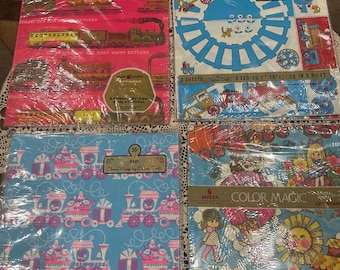 Puede incluir: Cuatro hojas de papel de regalo vintage con un tema de tren y bebé. El papel está impreso con trenes azules, rosas, rojos y amarillos, flores y estrellas. El papel mide 50,8 cm por 76,2 cm.